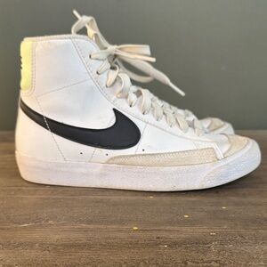 Nike White High-Top Sneakers with Black Swoosh